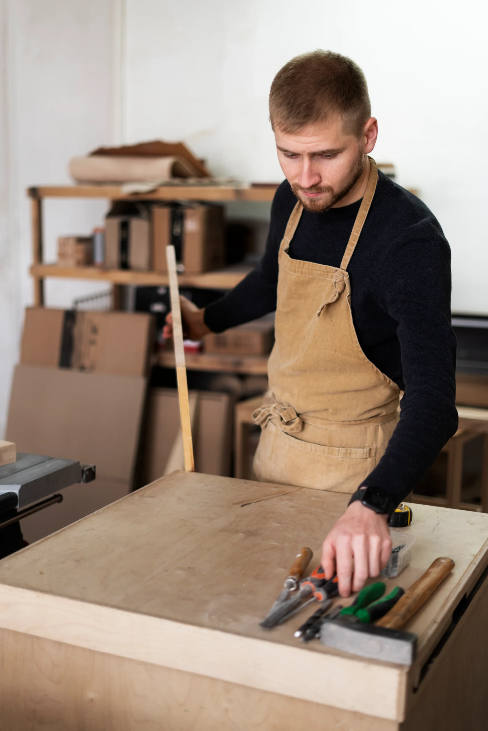 Rasmus, owner of OAK Studio, working in his woodshop